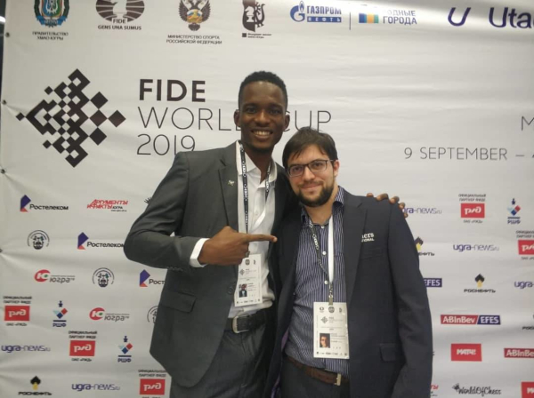 Proud to have lost after a creditable performance, Nigerian Daniel Anwuli poses with his winner.